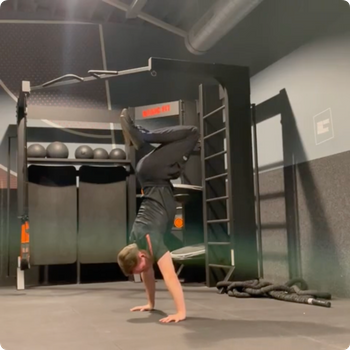 Freestanding tucked handstand