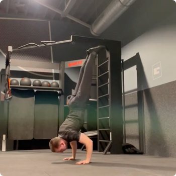 Press to handstand to handstand push up